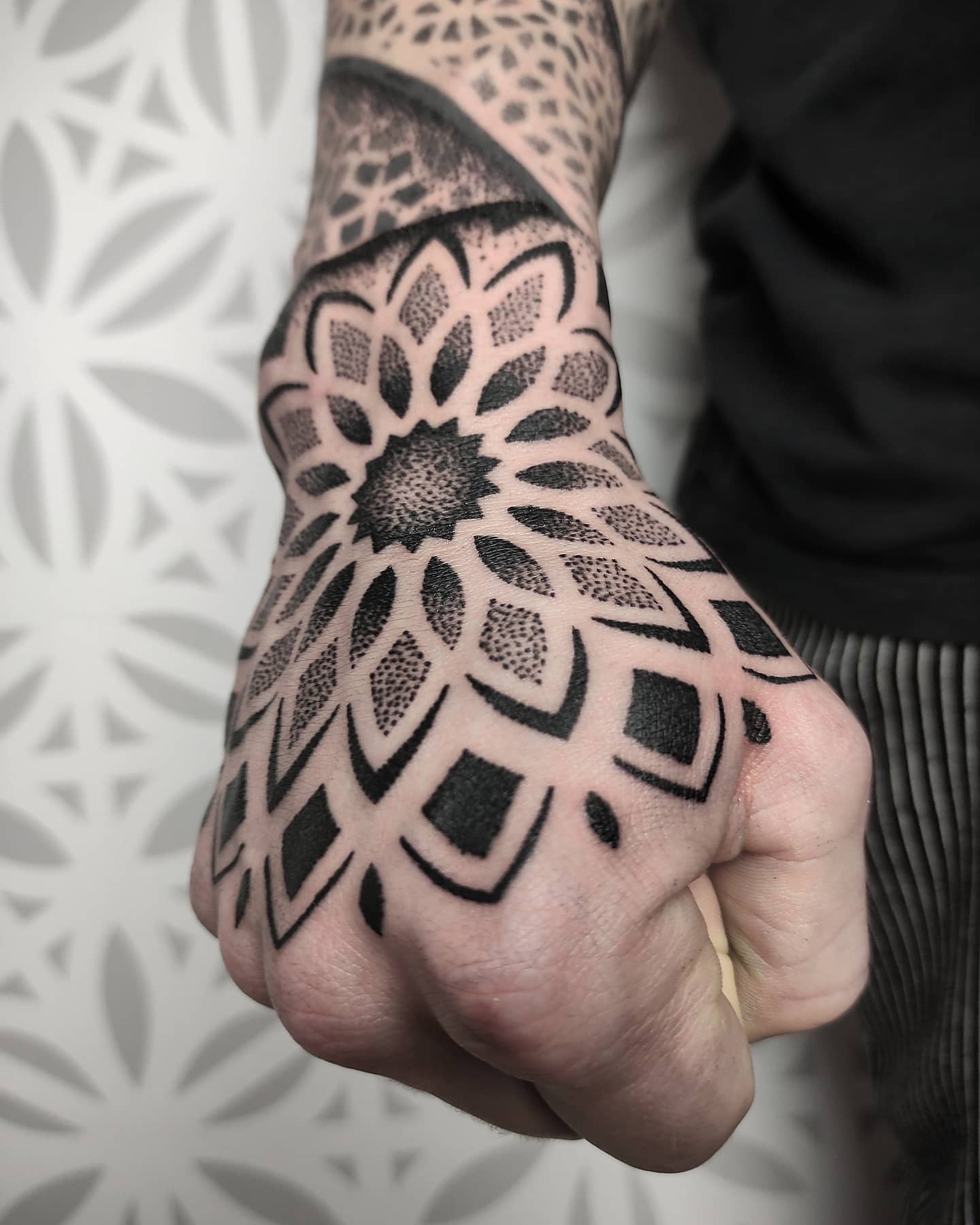 Dotwork mandala hand tattoo
