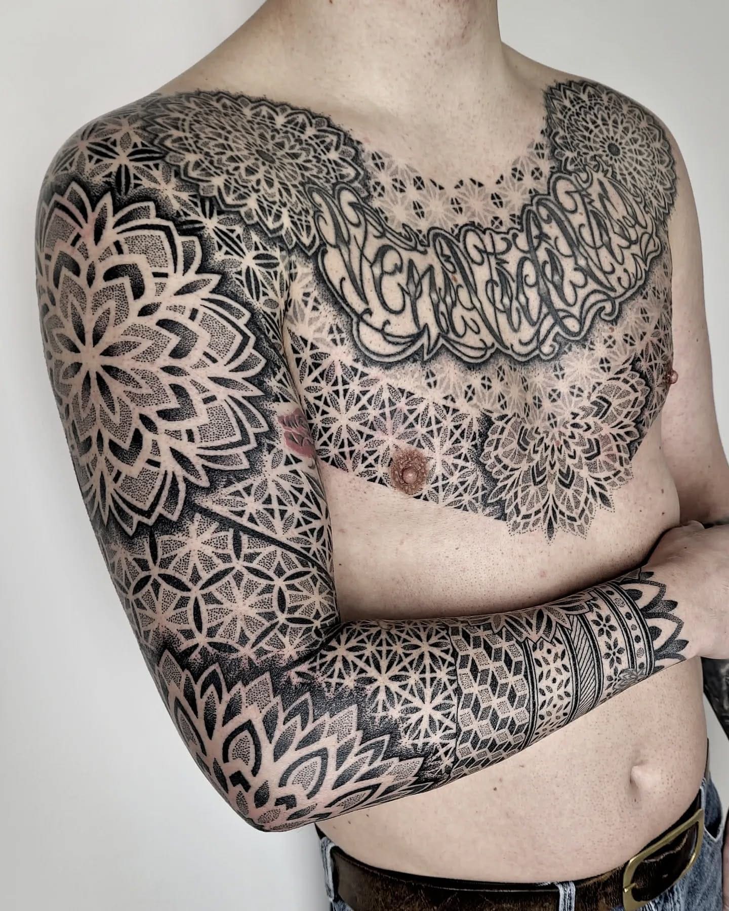 Detailed dotwork sleeve and chest tattoo