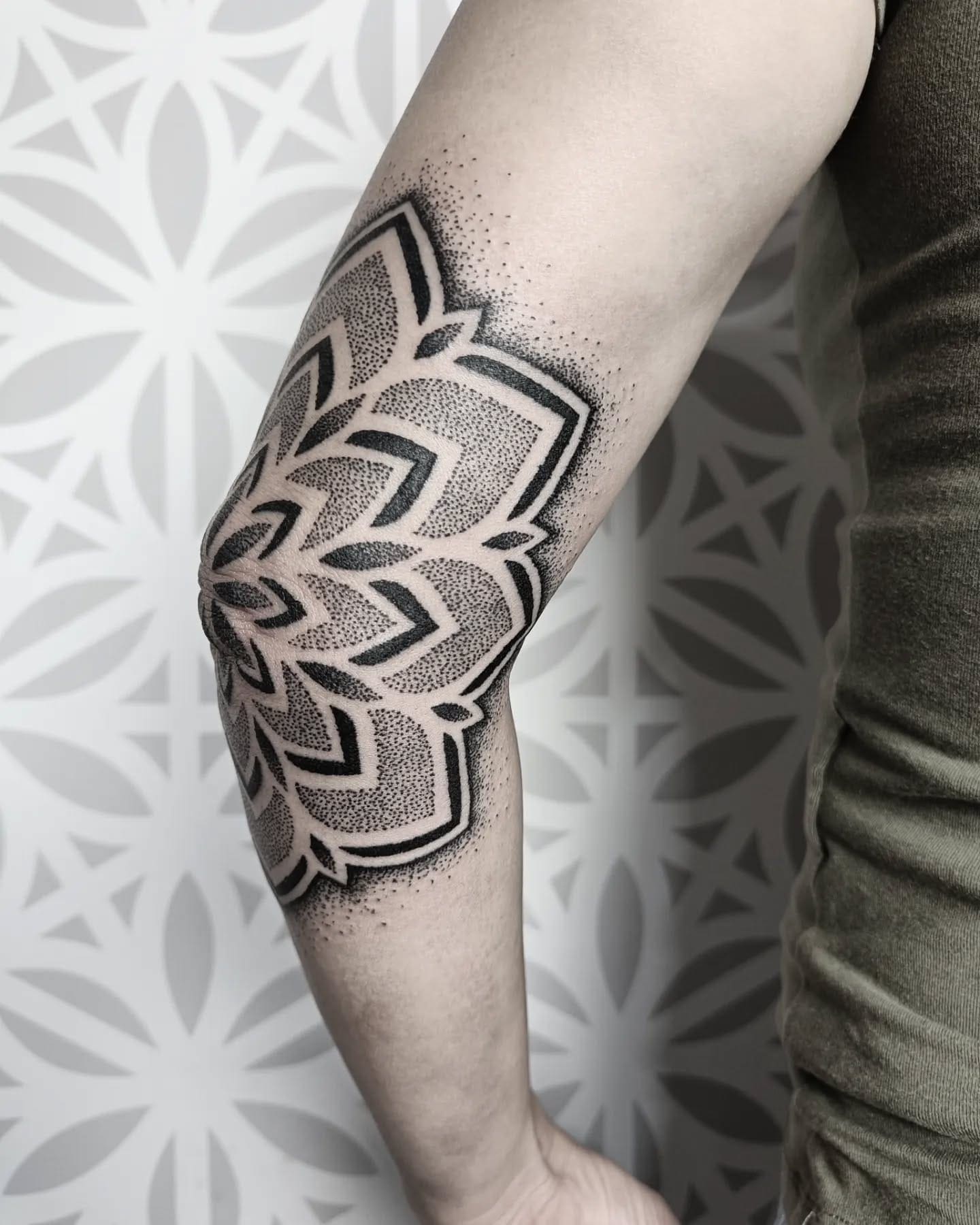Elbow mandala tattoo