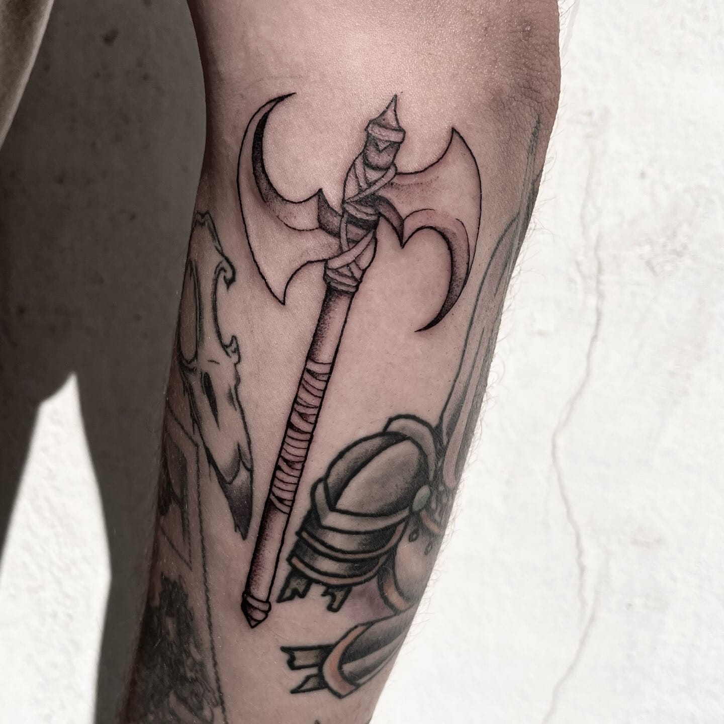 Double axe tattoo